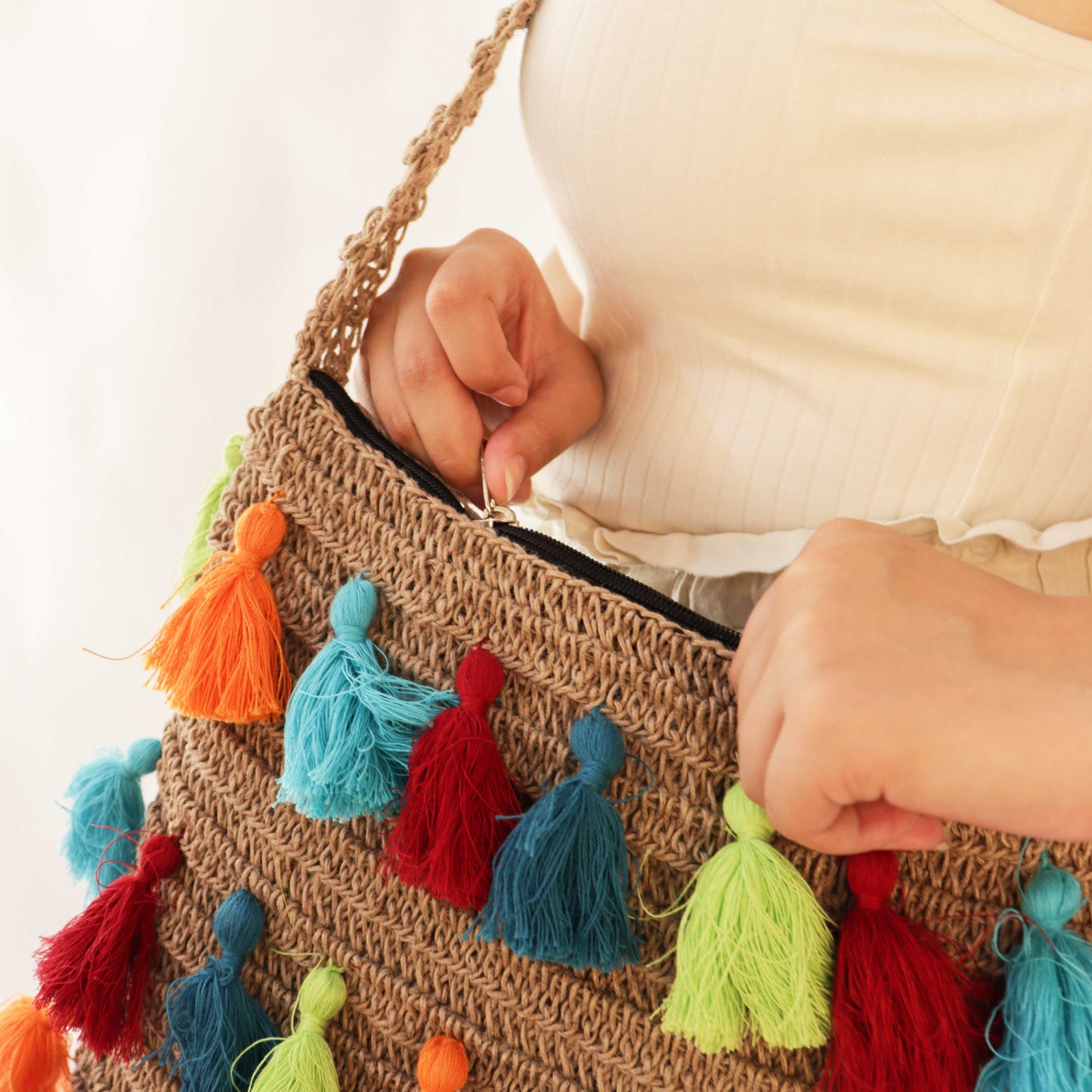 Tasseled crochet Quad-Spirit cross body bag